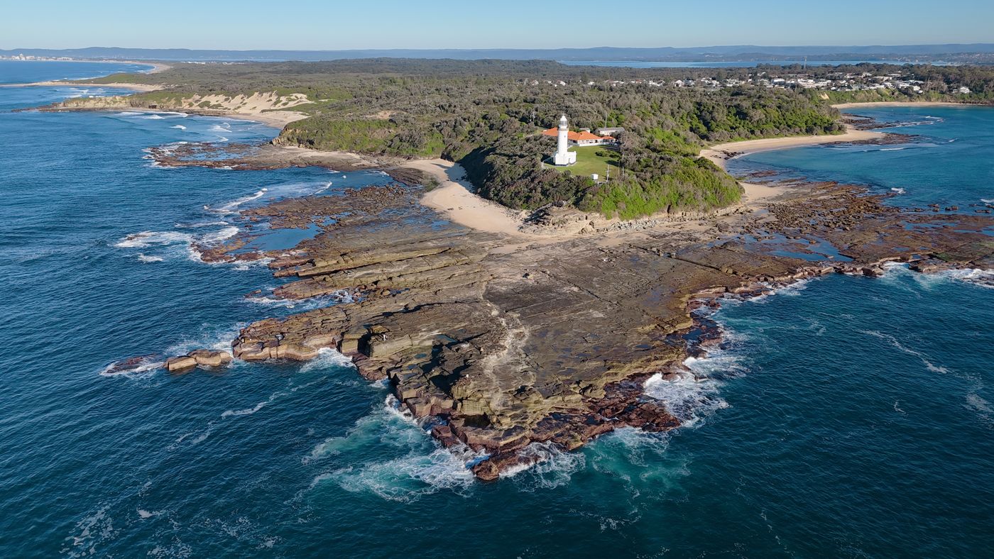 Aerial view of Norah Head lighthouse and its rock platform
